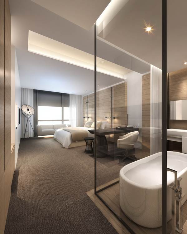 Baño en suite con paredes de cristal