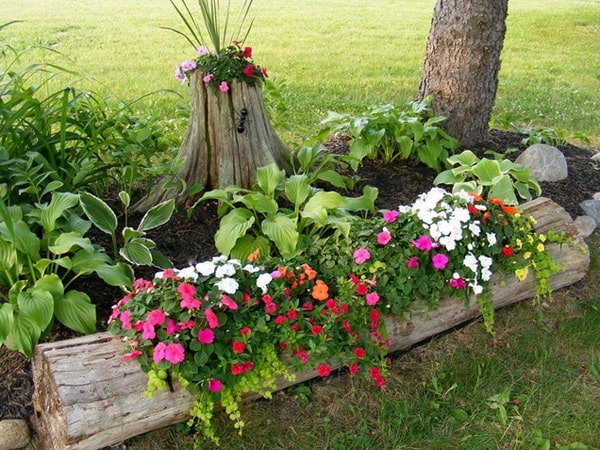 Decoración de jardines con troncos reciclados Jardineras con troncos reciclados