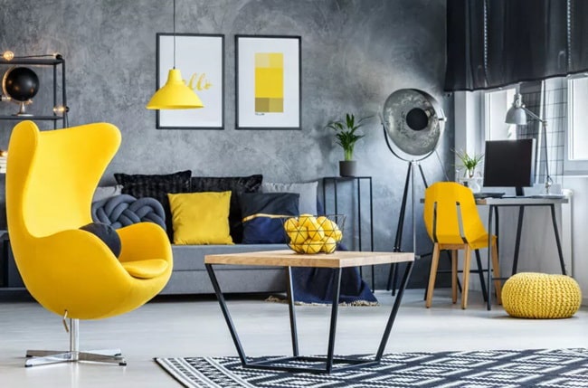 Salón en gris con detalles en amarillo