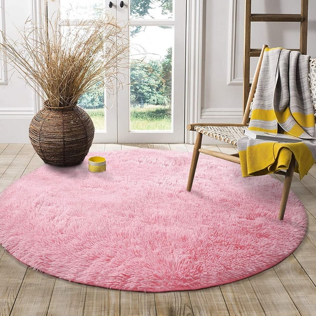 Alfombra redonda en color rosa